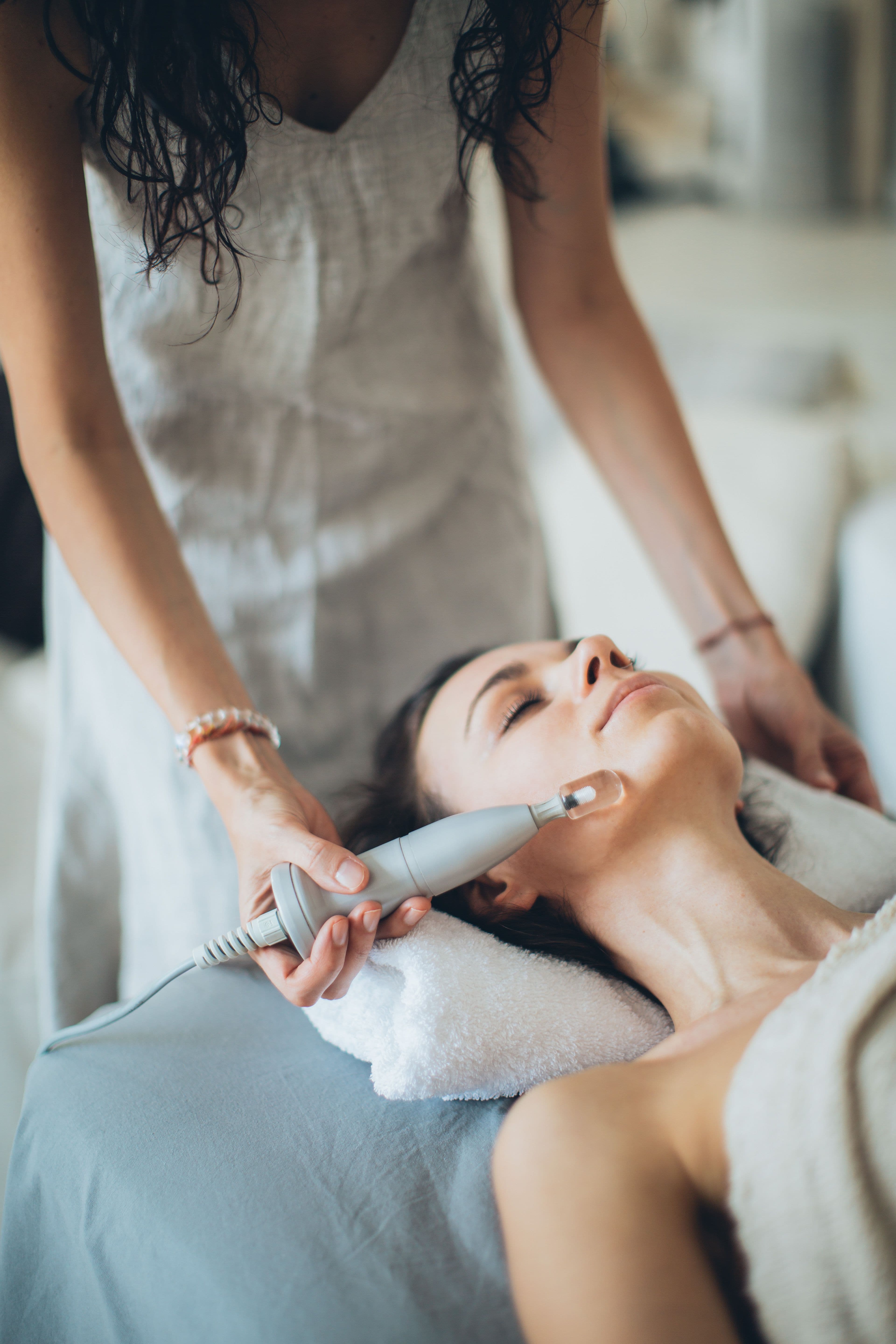 Wellness specialist giving a facial treatment